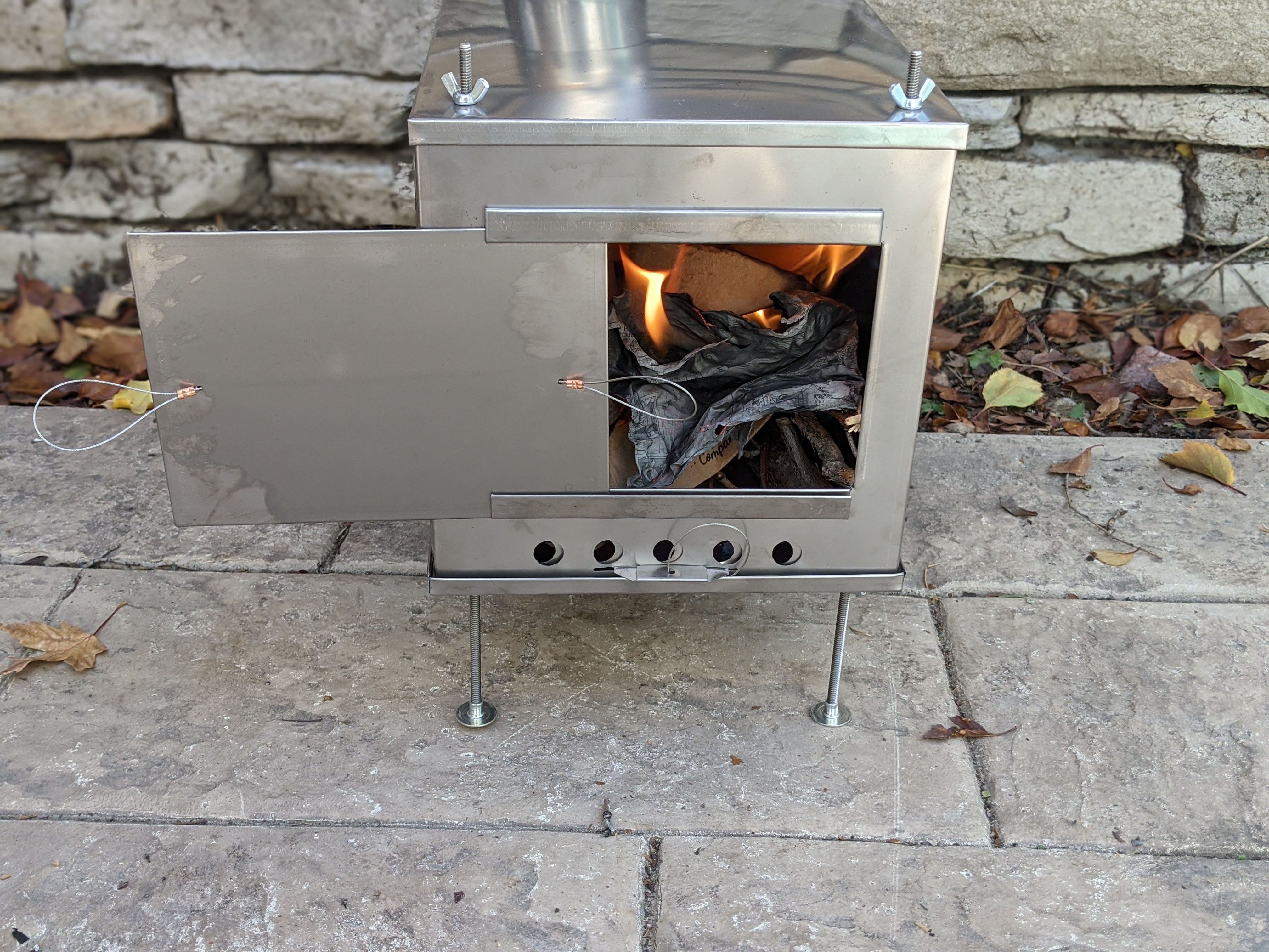 Burning in the stove for the backcountry and making sure the stovepipe is set.